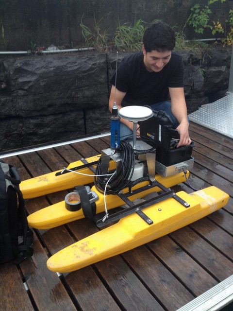 Sean Ferguson, an engineeing Masters student from the University of Ottawa, prepares the acoustic Doppler current profiler (aDcp) for a day in the field.  The aDcp unit records depth of the area as well as current and flow rates.