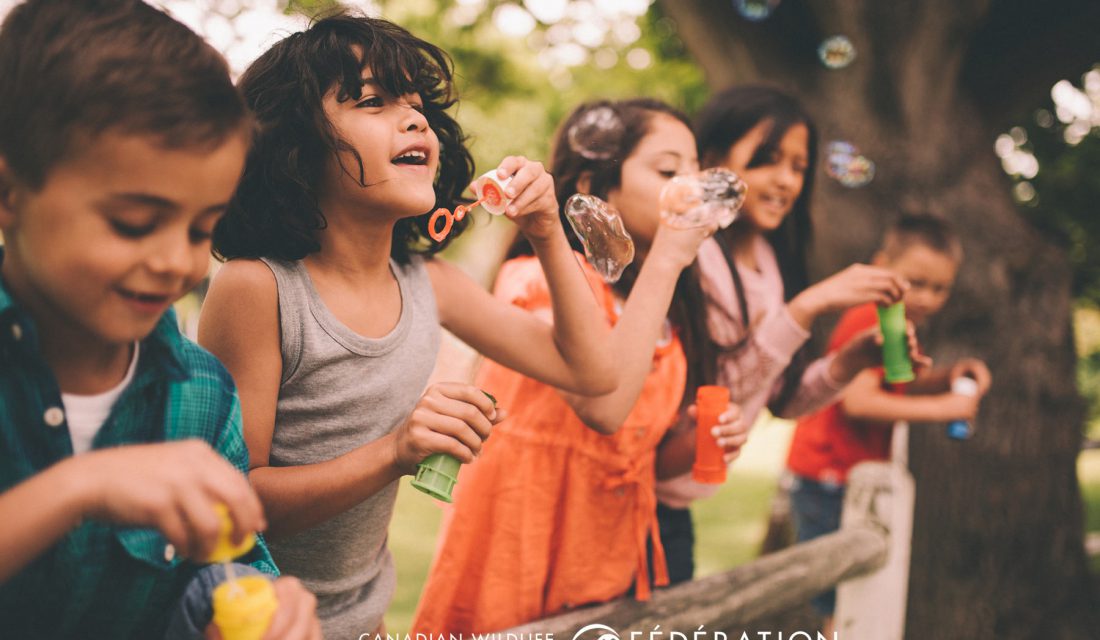 kids outside playing bubbles