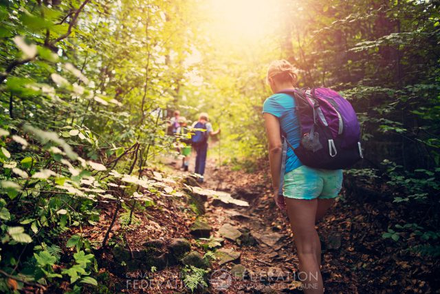 girl hiking in woods