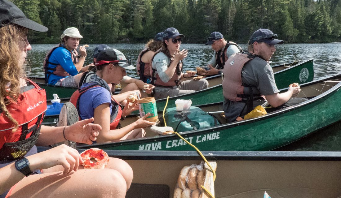Eating peanut butter and jelly bagels while rafted-up in Algonquin Provincial Park 