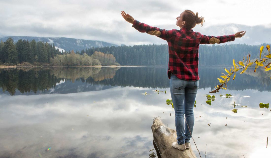 woman standing by lake