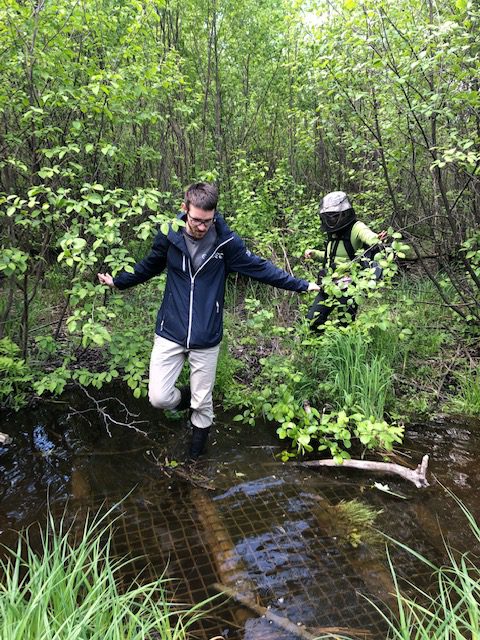 Chris crossing a creek