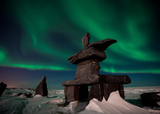 Northern Lights and the Inukshuk by Shafik Diwan