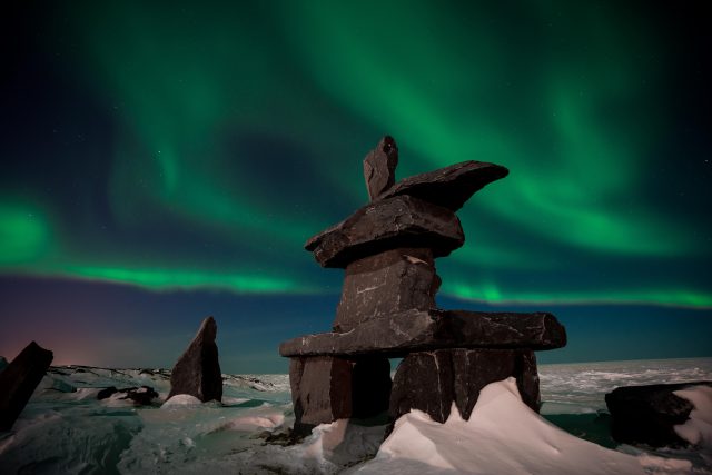 Northern Lights and the Inukshuk by Shafik Diwan