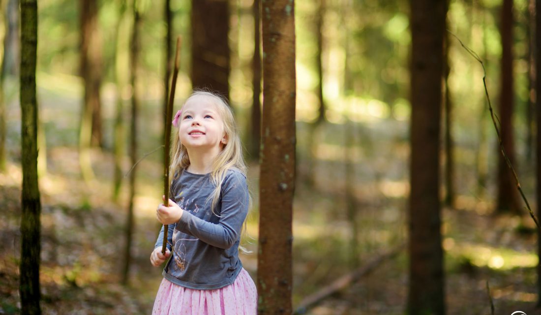 girl outside forest exploring