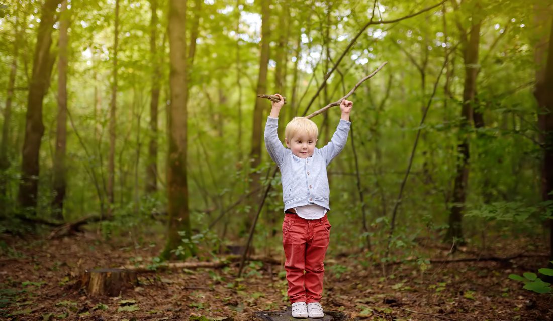 boy outside forest