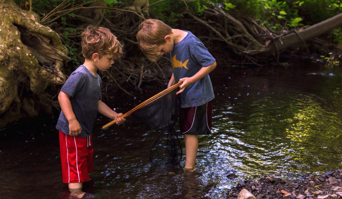 boys playin in creek