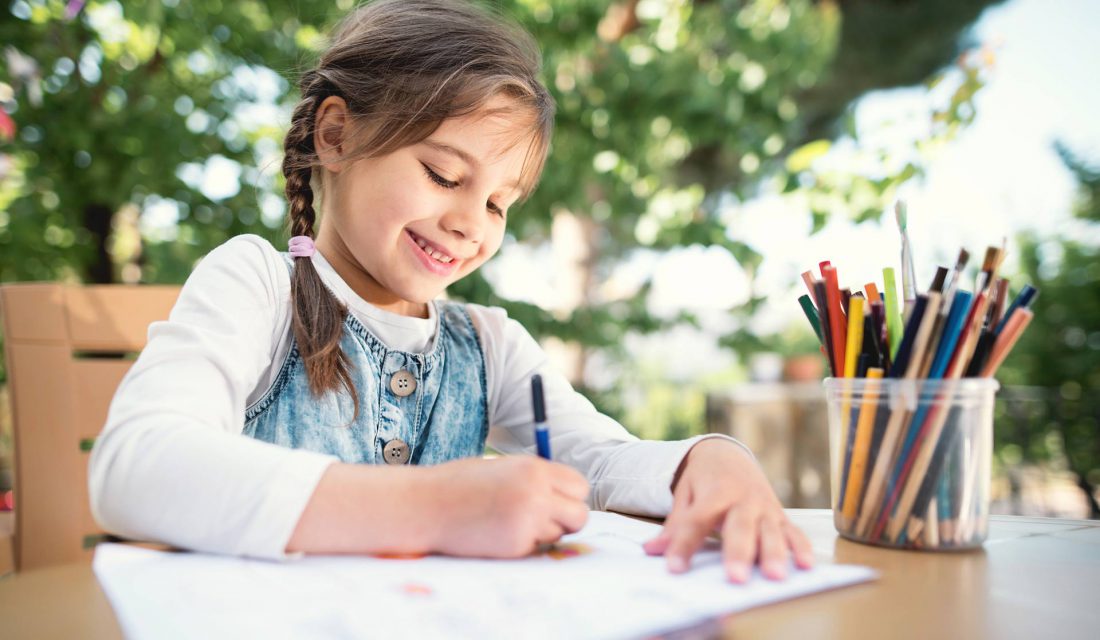 child colouring outside